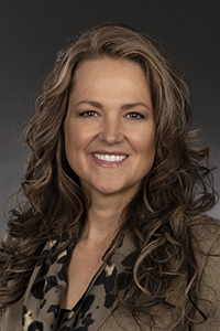 Headshot of dental hygiene professor Leciel Bono in a tan and brown blouse