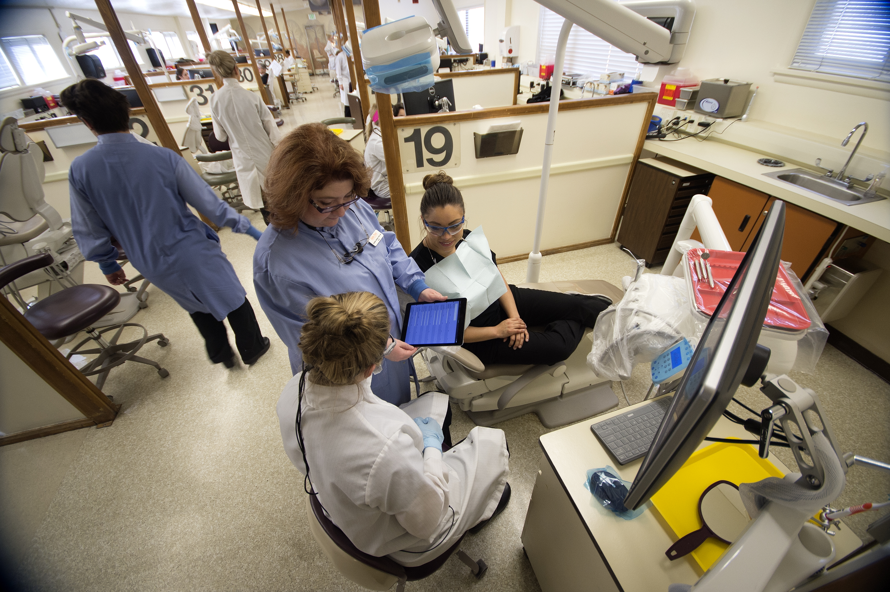 Dental Hygiene faculty instructing students at clinic