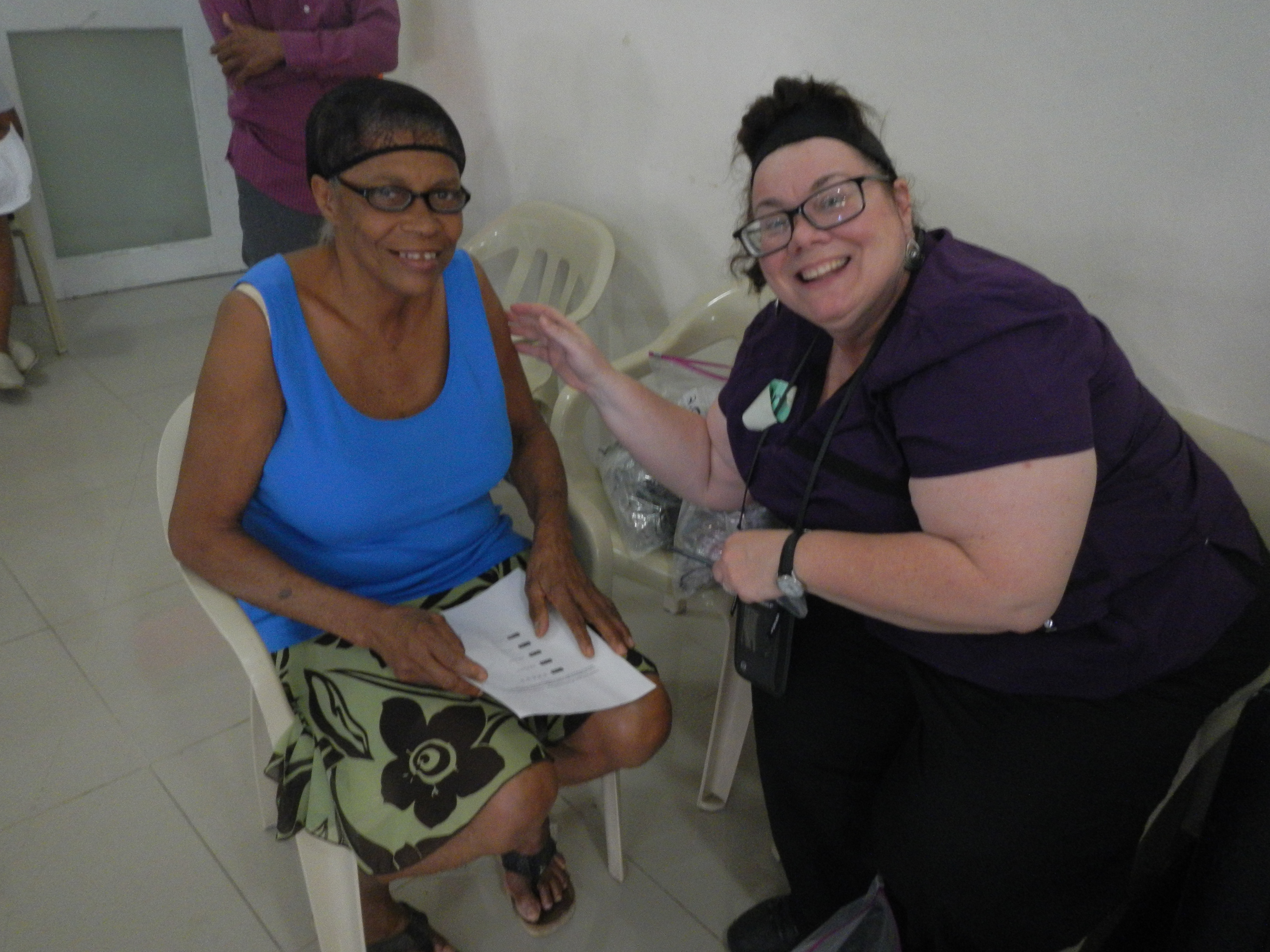 ISU student with a smiling patient in the Dominican Republic