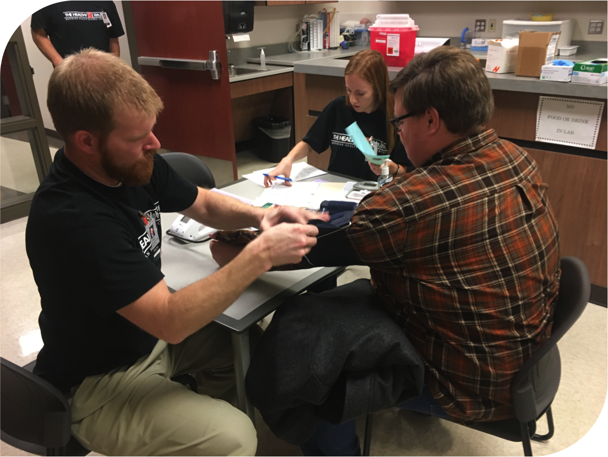 Meridian students at the physical exam station where the traumatic brain injury screening takes place.