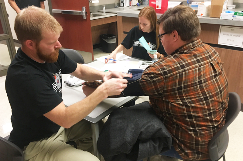 Meridian students at the physical exam station where the traumatic brain injury screening takes place.