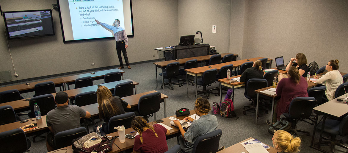 Students attending a lecture in distance learning room