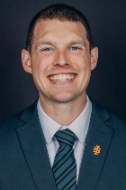 Professional headshot of James Peterson with suit and tie