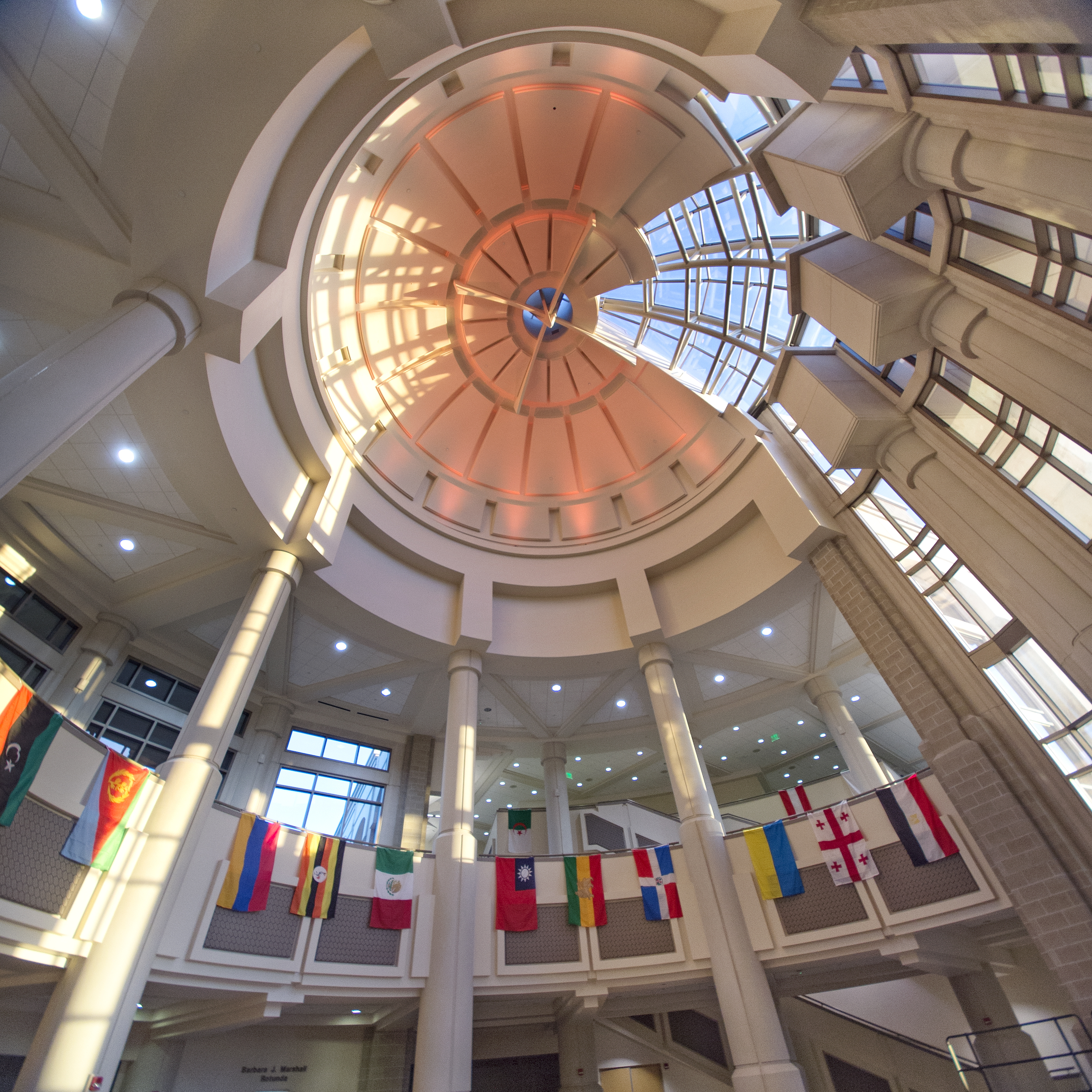 The inside of the Stephens Performing Arts Center with country flags hung from the balcony.