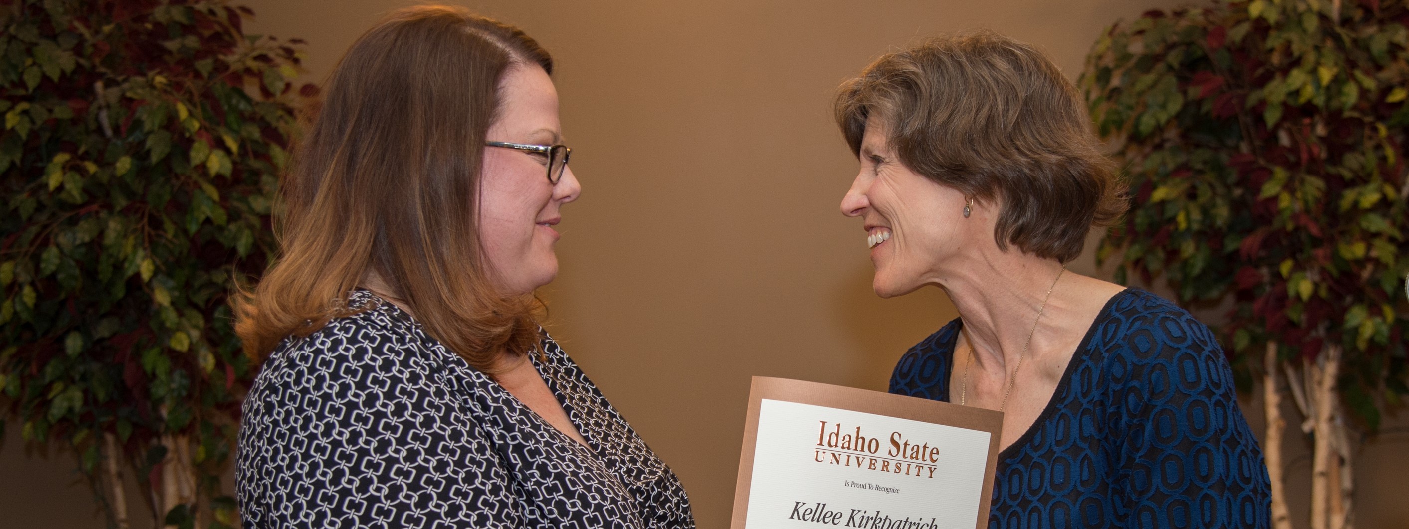 Kellee Kirkpatrick receiving a distinguished faculty award