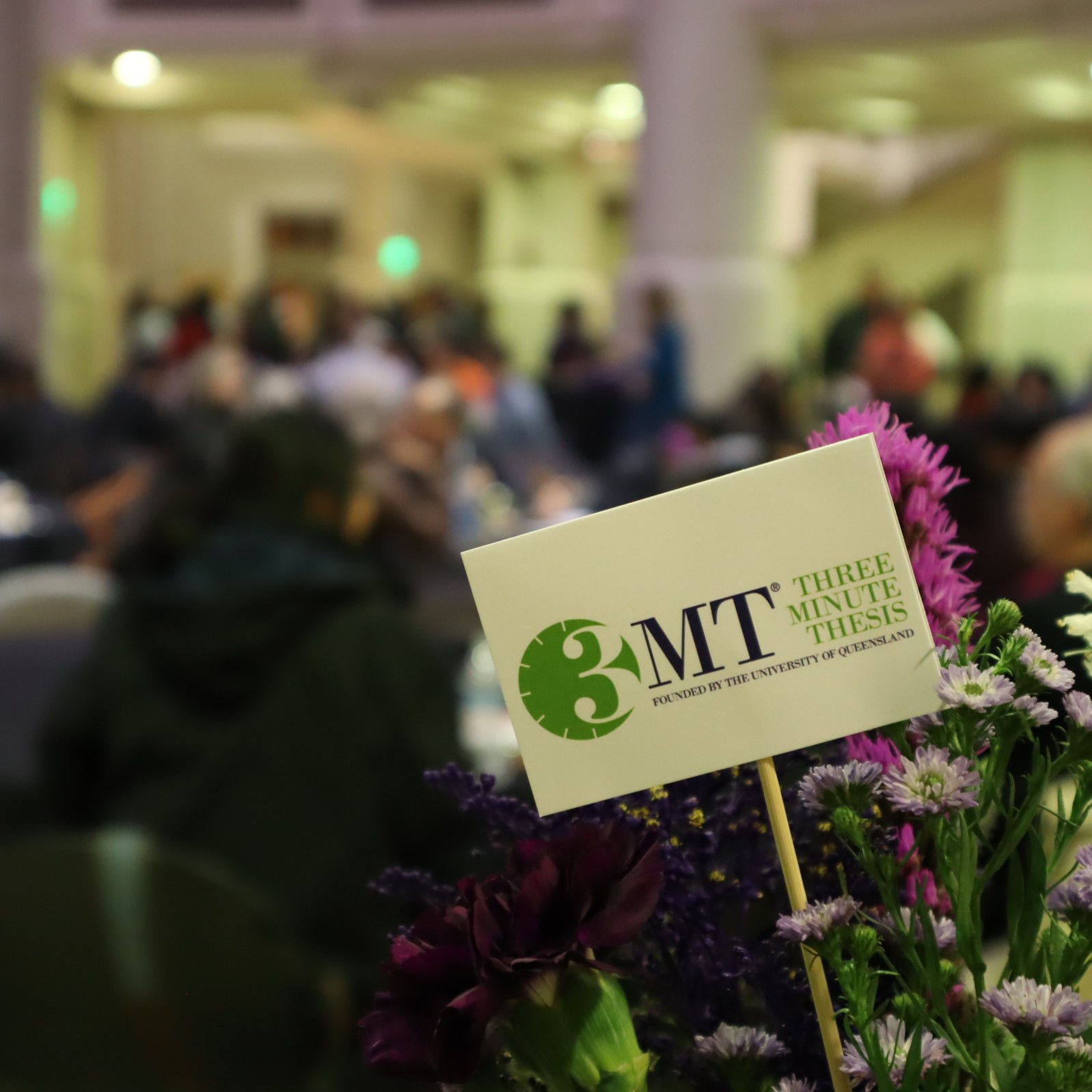 Vase of flowers with the 3MT logo in them