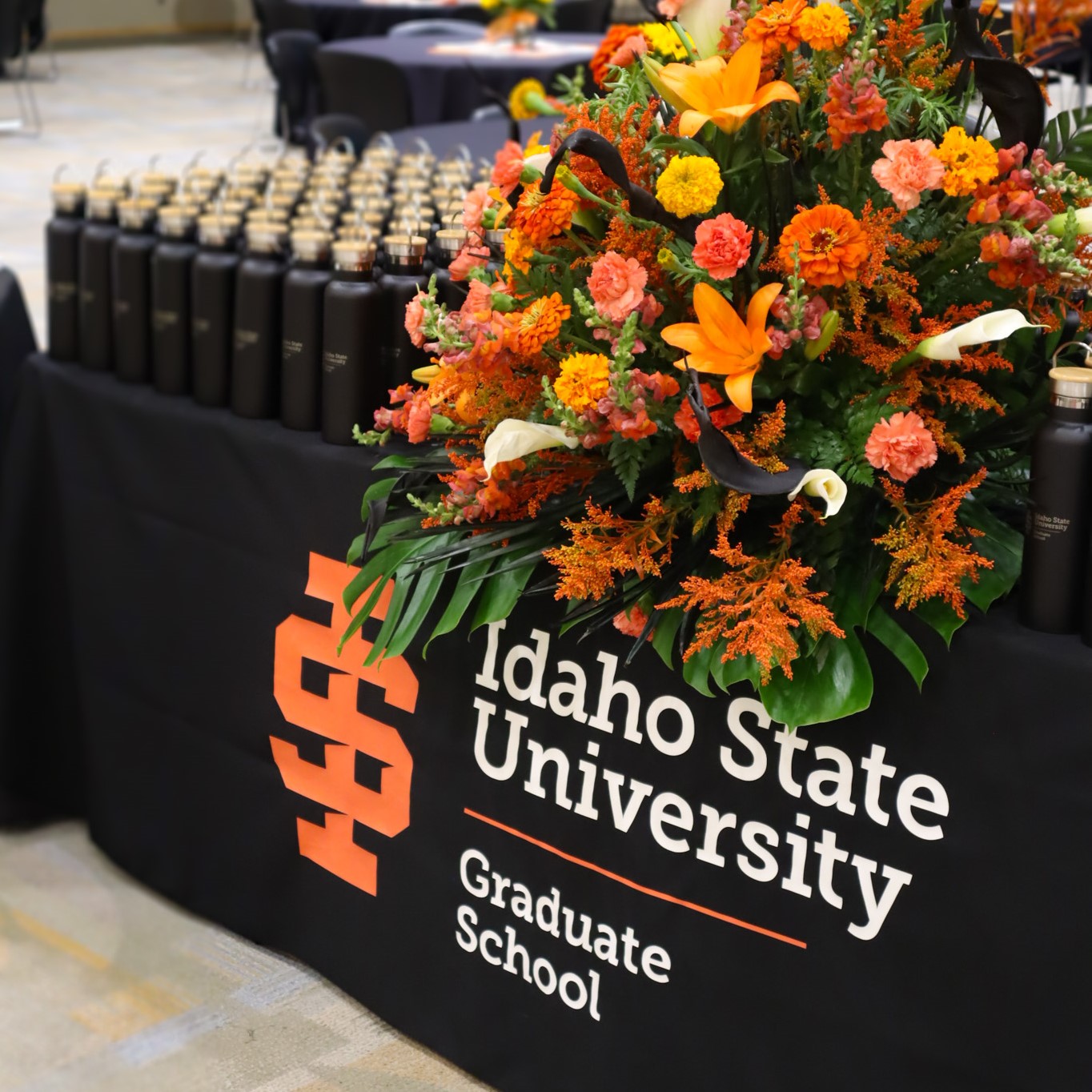 large flower arrangement sitting on the GNSO check in table