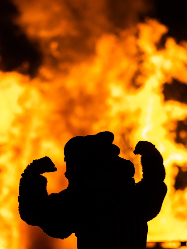 Benny flexing in front of the bonfire