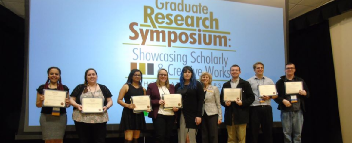 Winners of the ISU Graduate Research Symposium on stage
