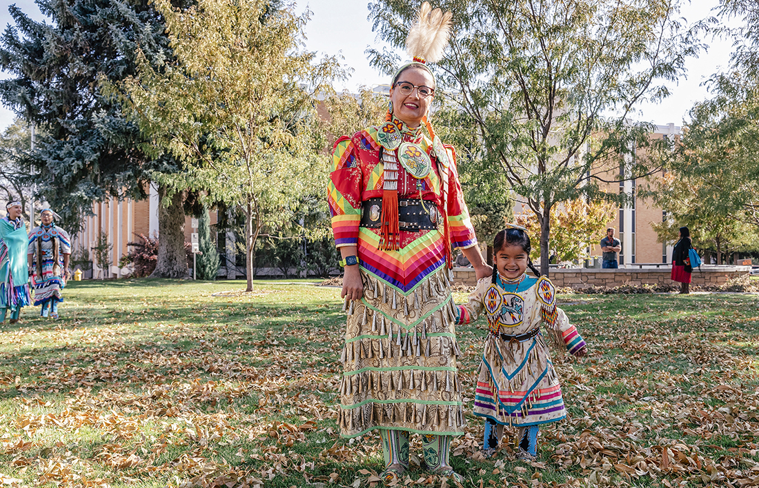 A woman and a child in traditional indigenous clothing