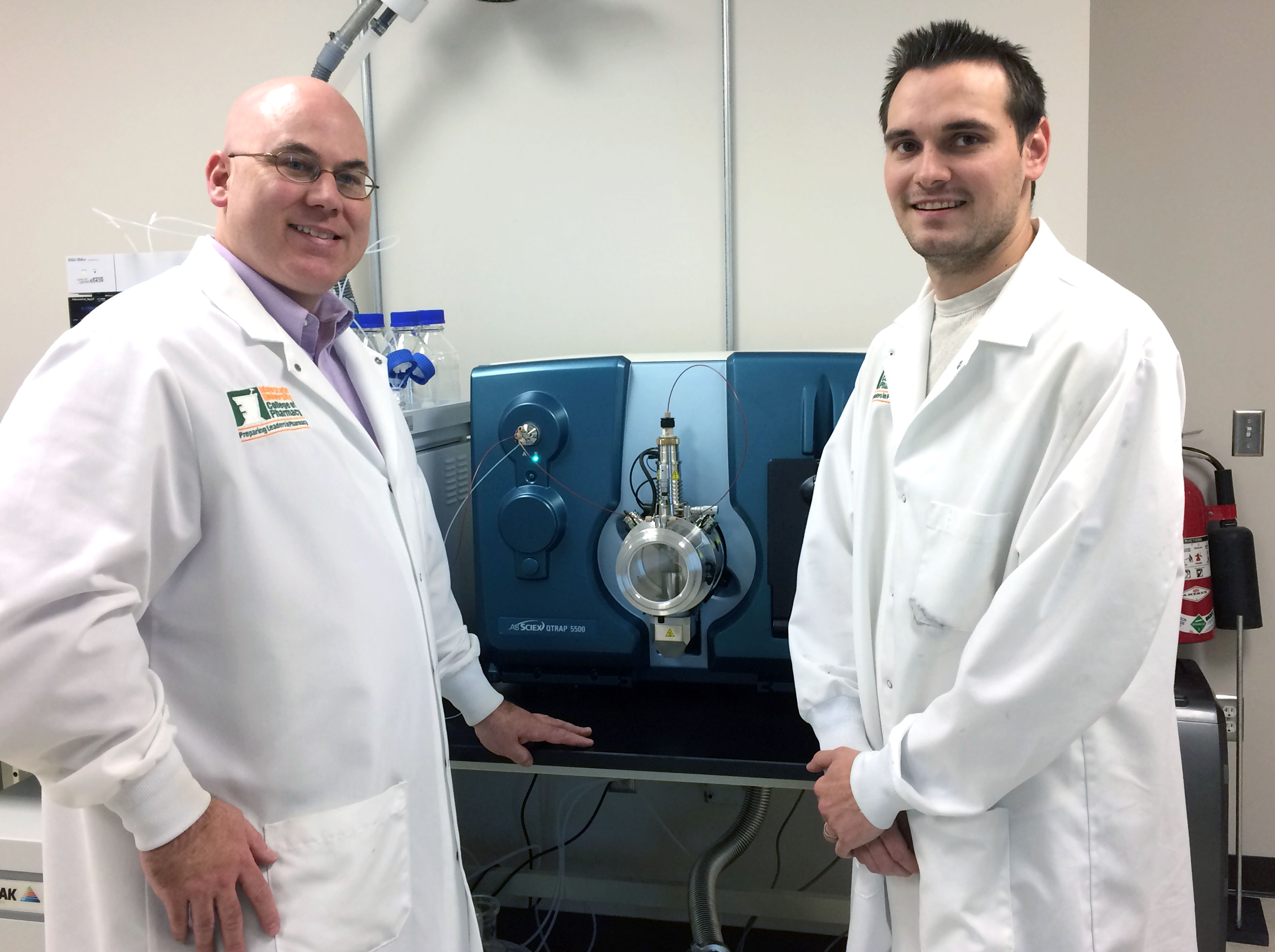 Kirk Hevener and Ben Walsh with Mass Spectrometer