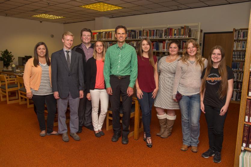 Students and professor posing for group photo