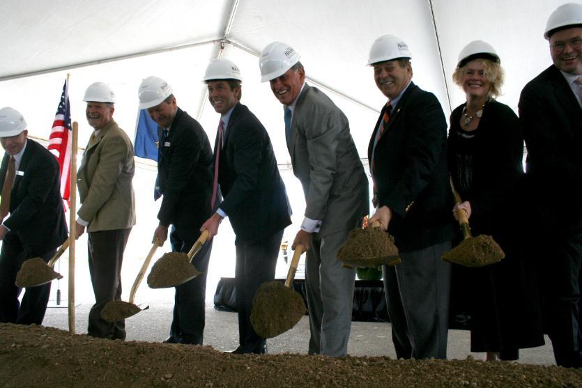 Dignitaries shoveling dirt