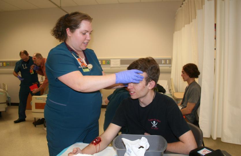 Nursing student treats patient in mock disaster 