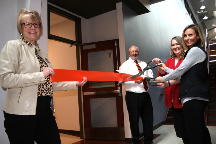 People cutting ribbon at grand opening of Benny's Pantry at ISU Meridian.