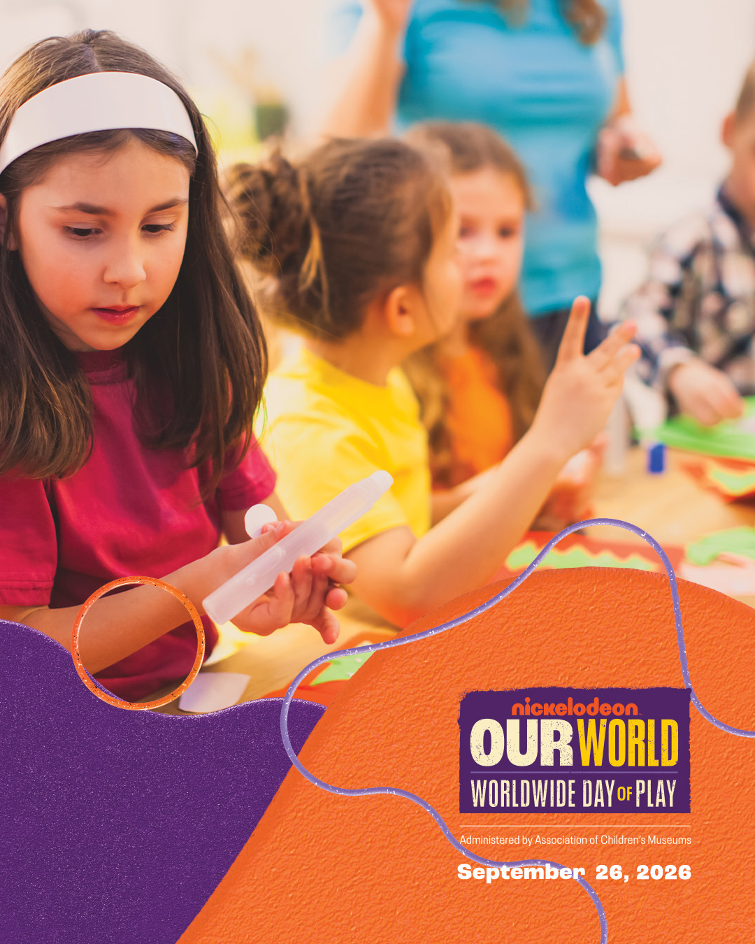 Children exploring crafts with world day of play logo over laid