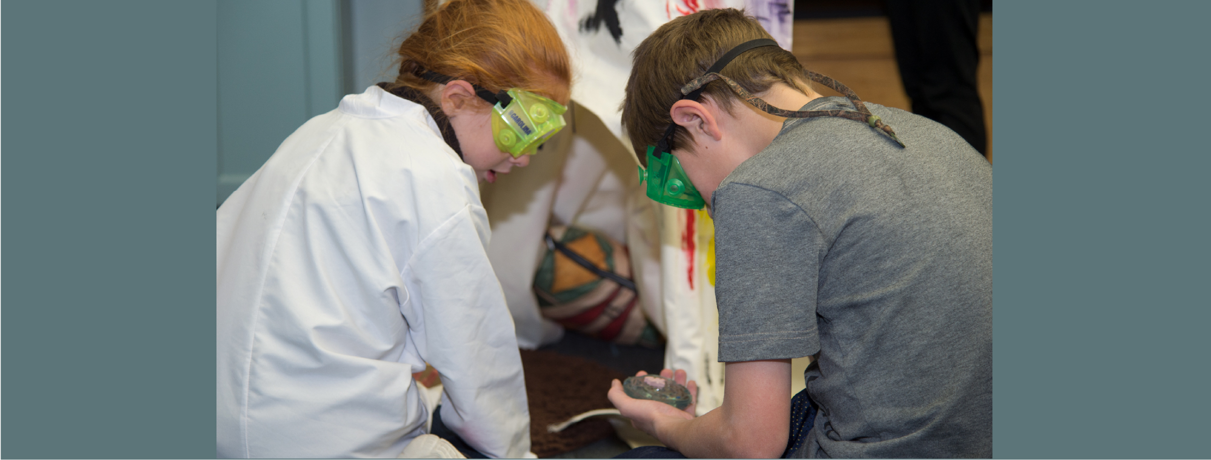 Boy and girl examining specimens