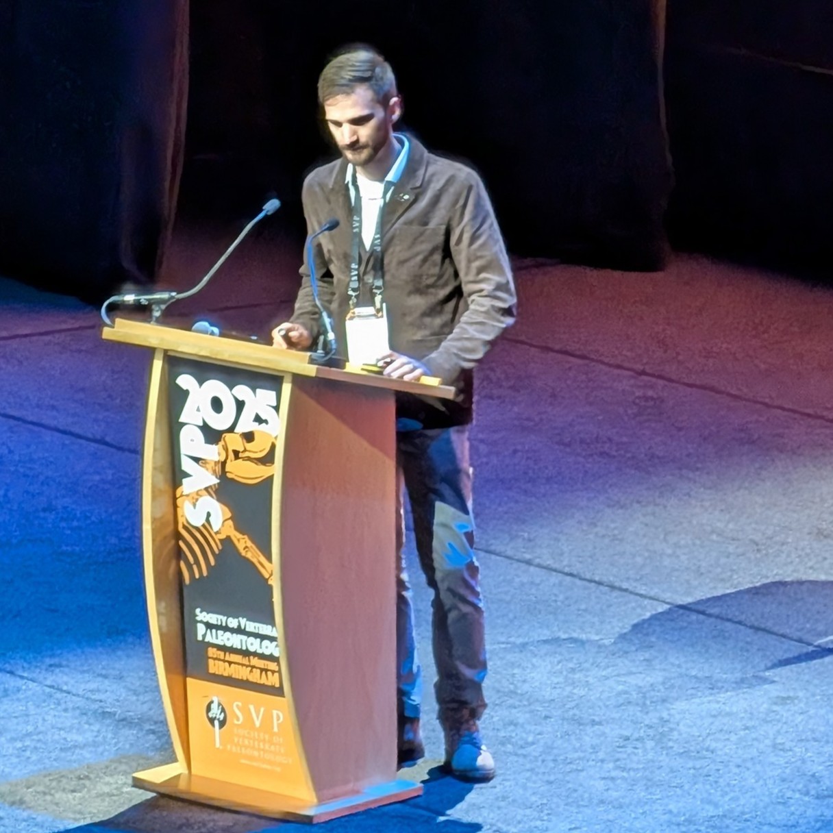 Gary McGaughey at a podium presenting research