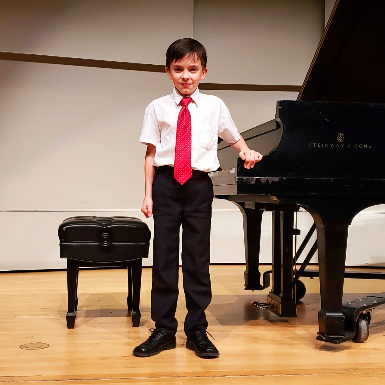 Boy posing at piano