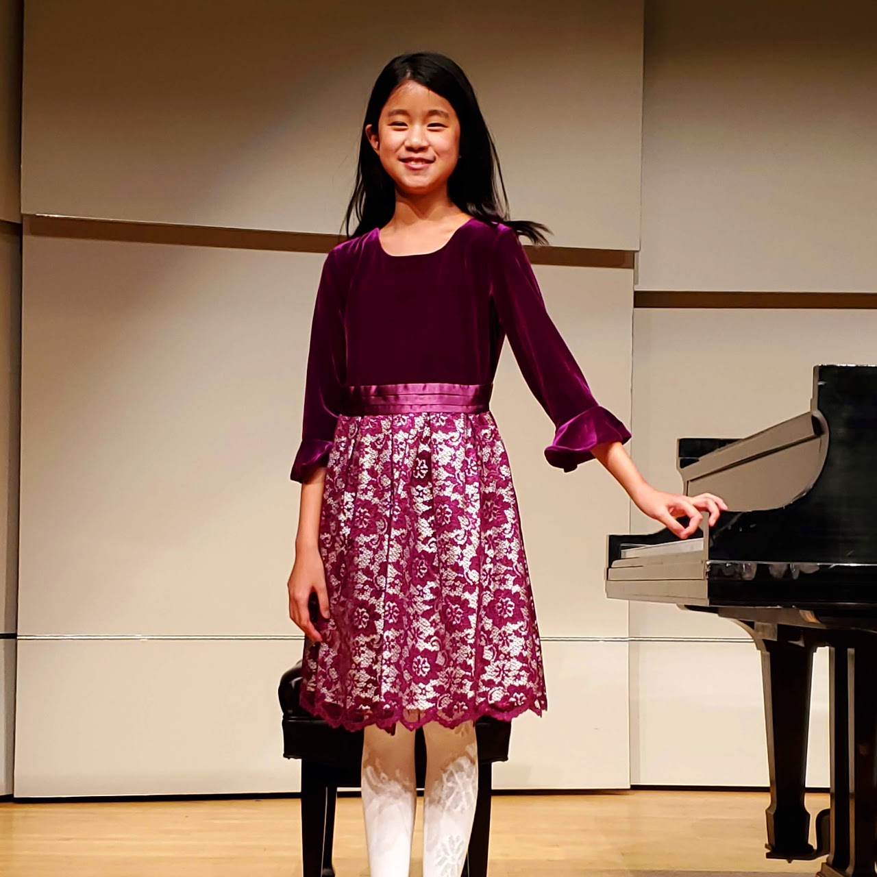 Girl posing at piano