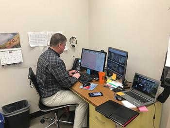 Bengal Pharmacy’s Bret Jacobson, PharmD, uses his laptop at an office in Pocatello to monitor prescription dispensing in Arco.