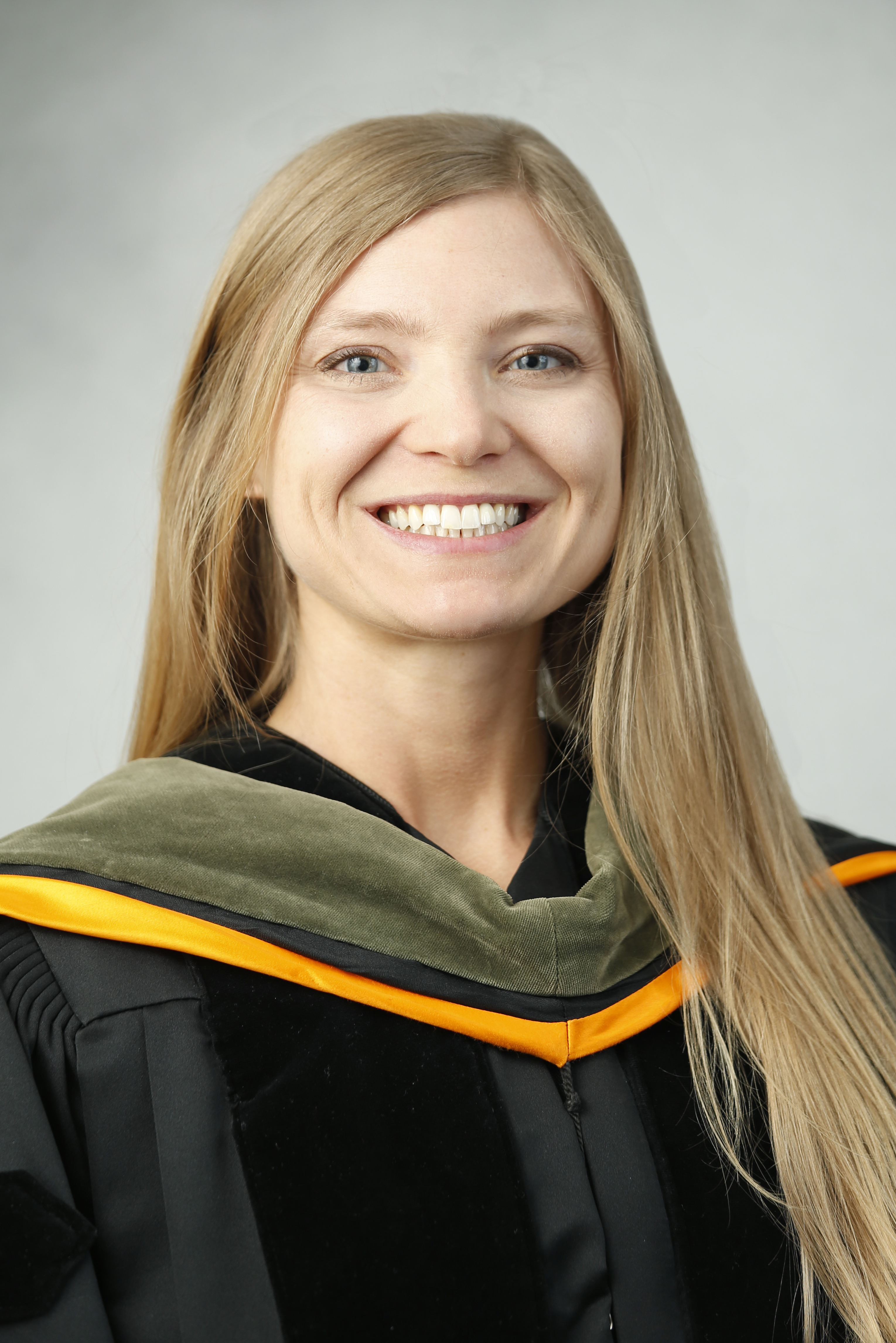 Corrie Black in commencement regalia