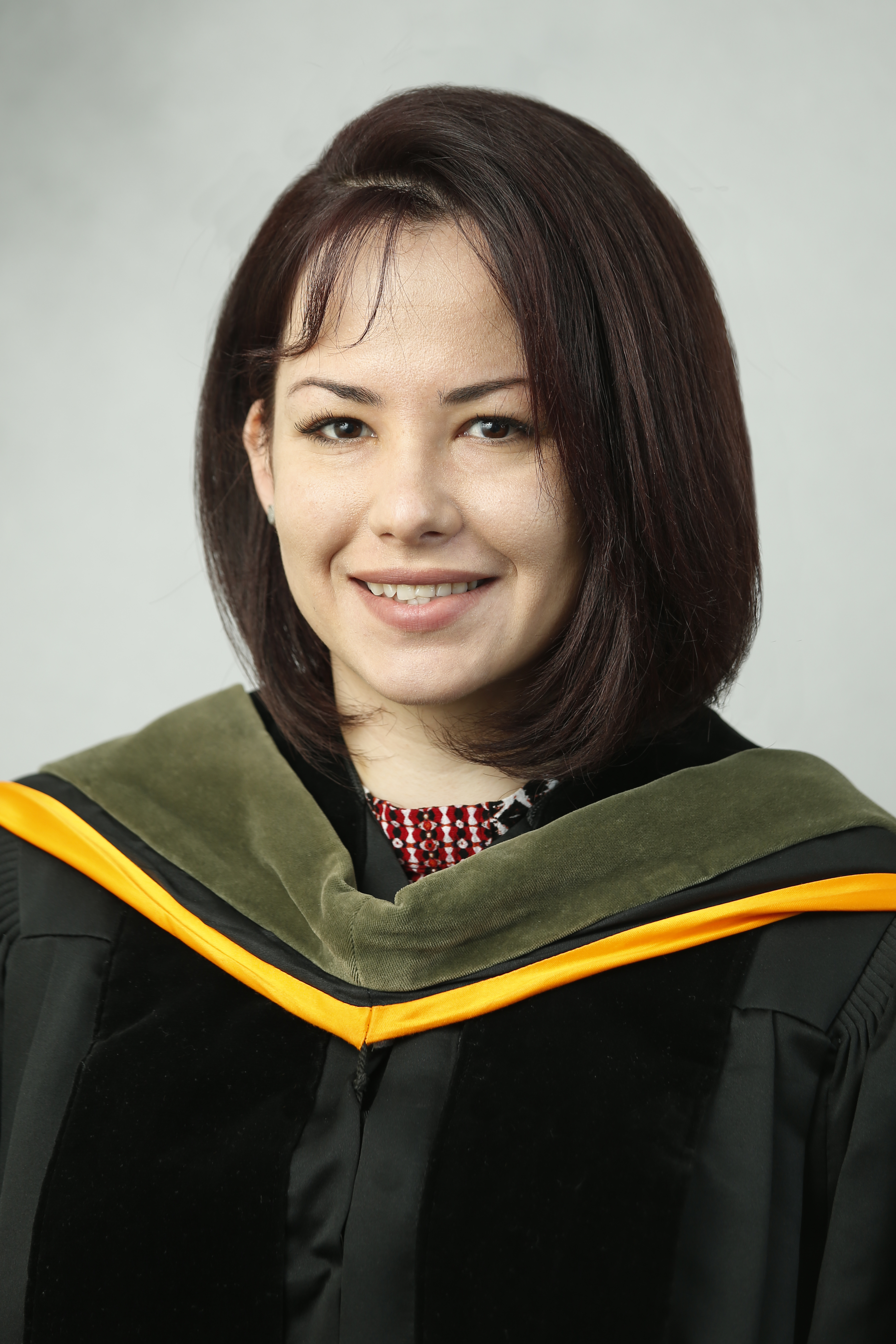 Maddie Gonzalez Perez in commencement regalia