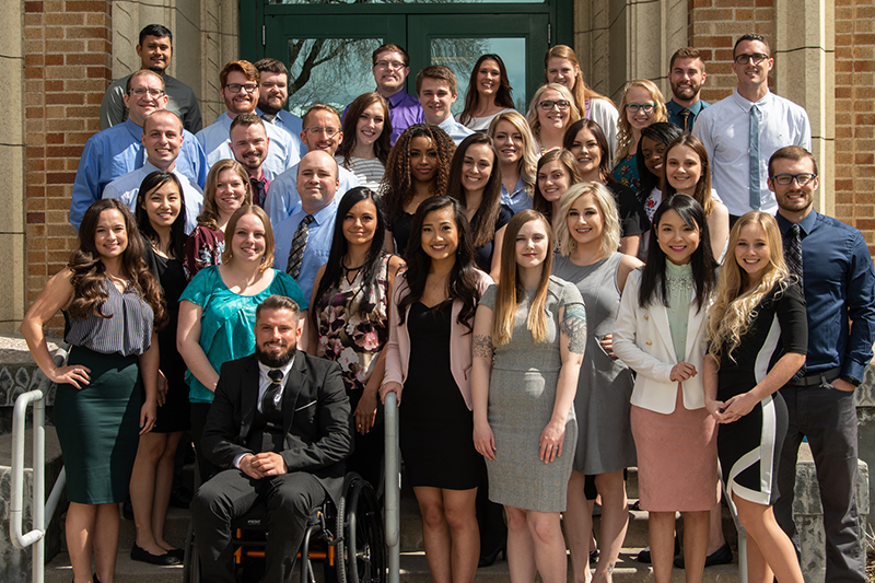 Pocatello College of Pharmacy Class of 2020 outside Leonard Hall on a sunny day