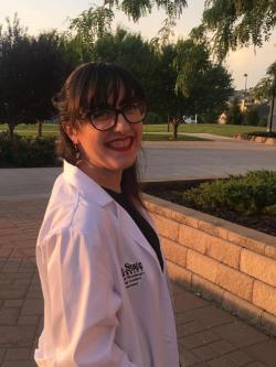 Sasha Heyneman at the White Coat Ceremony outside Stephens Performing Arts Center