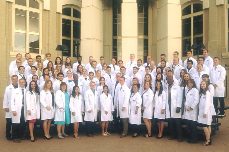 New pharmacy students from Pocatello and Meridian (P1s) receive their white coats in a traditional ceremony