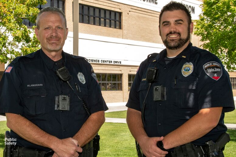 Two University Public Safety Officers smiling