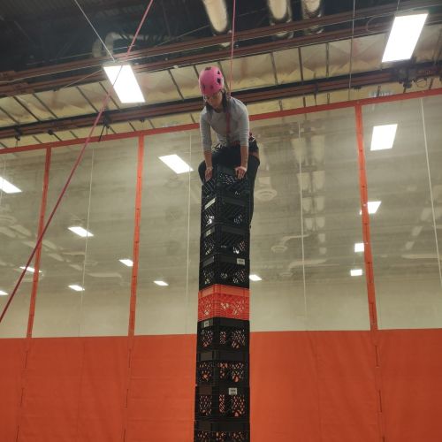Climber using milk crates to climb