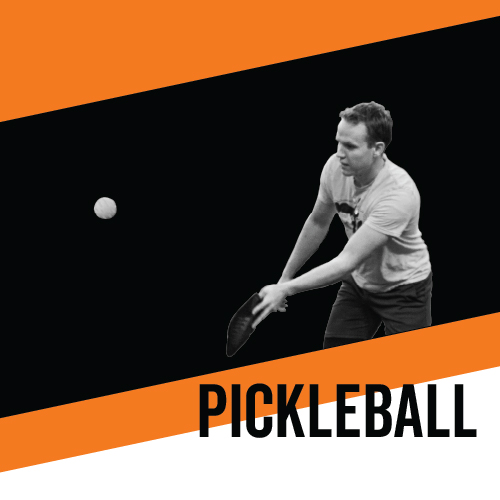 Black and white image of a student playing pickleball