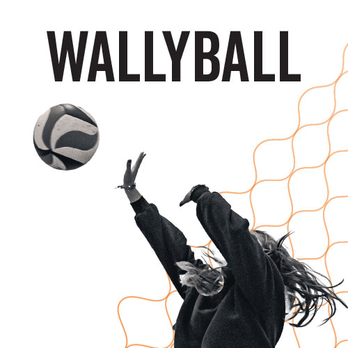 Black and white photo of a girl going in to spike a volleyball