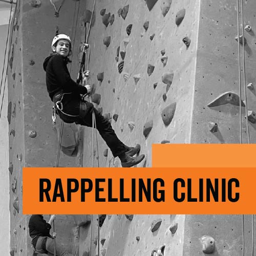 Student Rappelling from indoor climbing wall