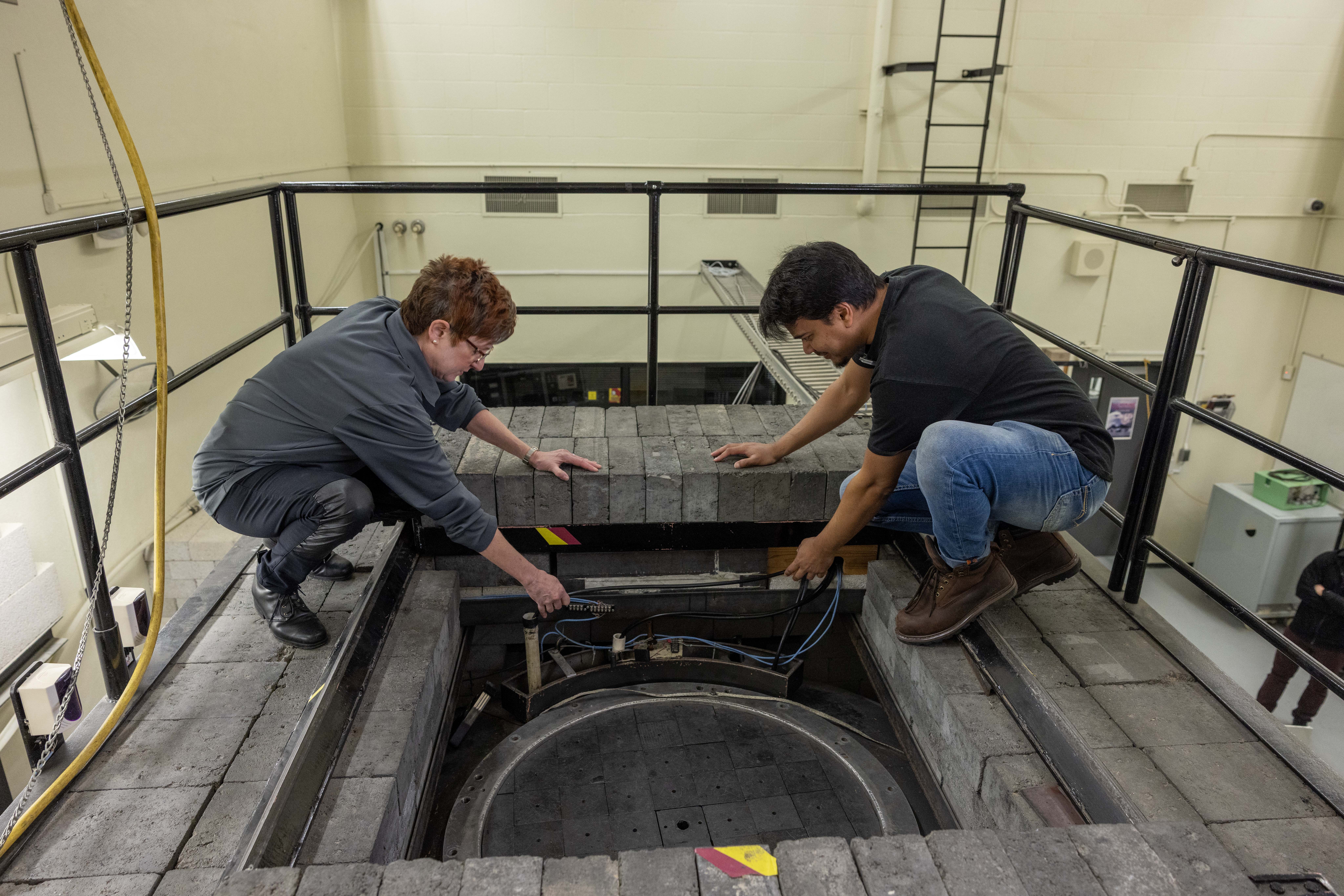 Mary Lou Dunzik-Gougar with doctoral student Maruf Anwarul at the nuclear reactor on February 13, 2025.
