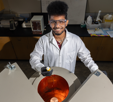 Student with Radioactive Sample