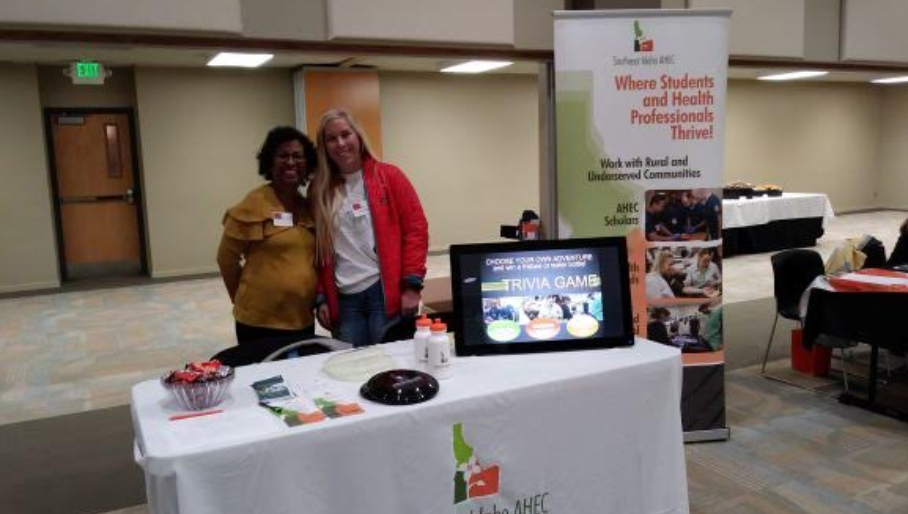 Two Southeast Idaho AHEC representatives using an interactive game at a continuing education event.