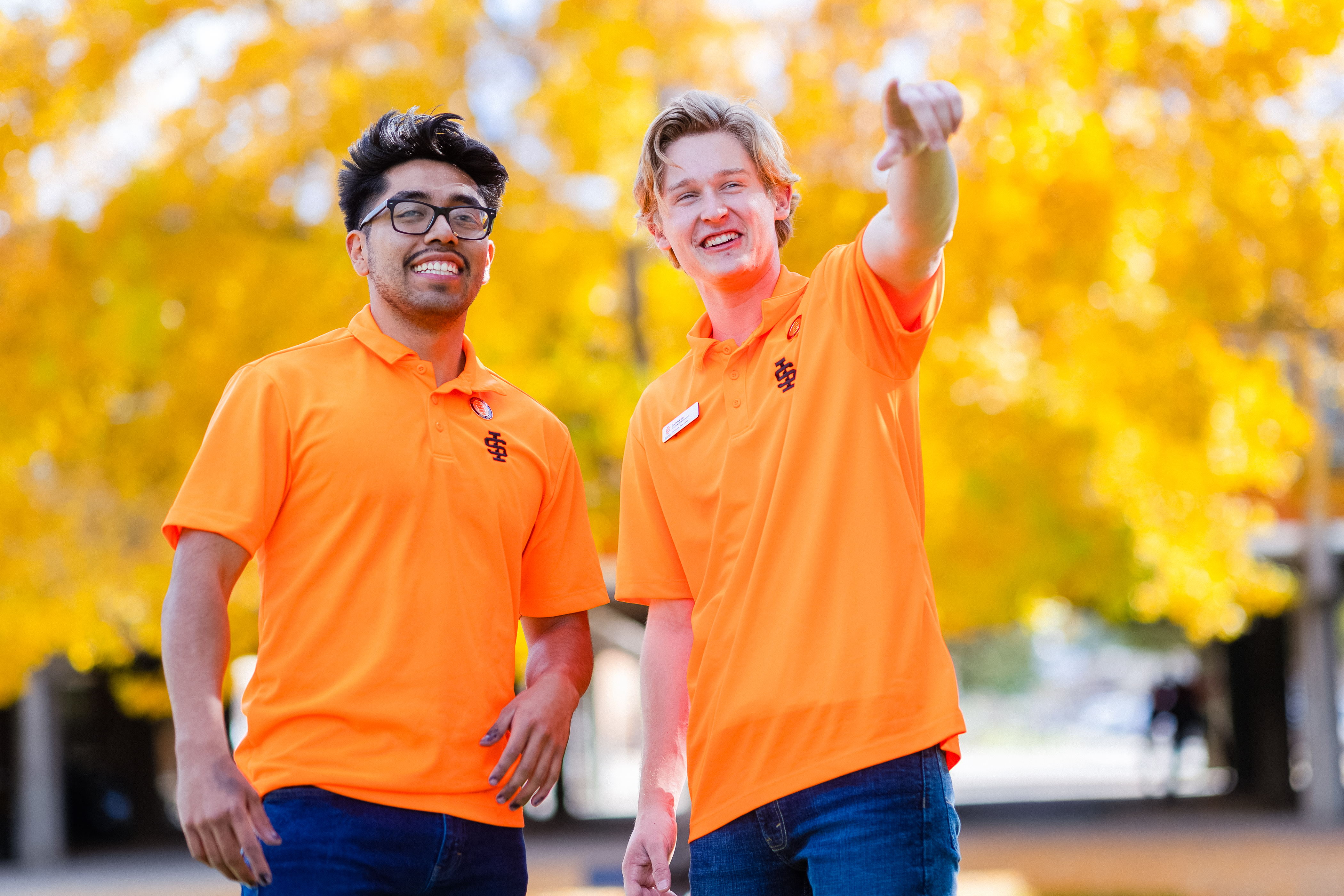 Two staff members in Roarange ISU shirts smiling