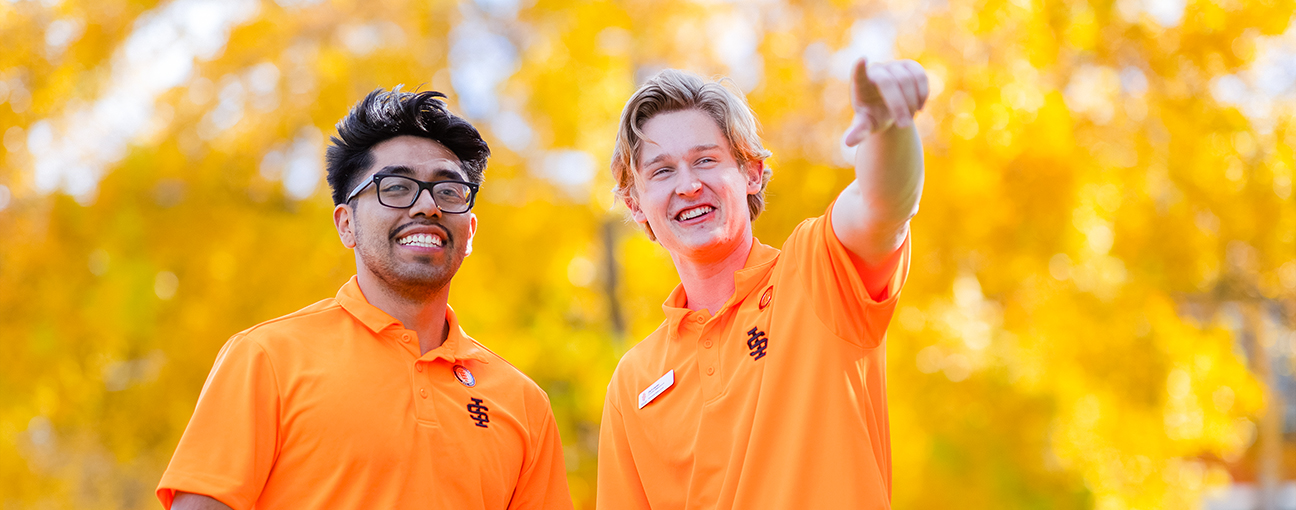 Two ISU Staff members outdoors in Autumn