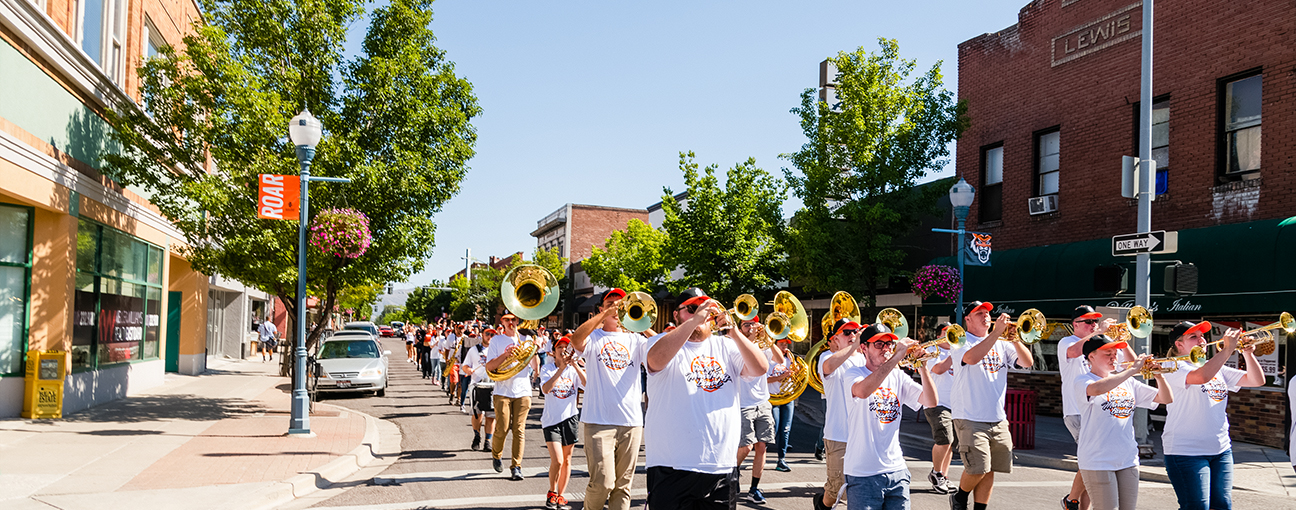 The ISU Marching Band playing in a parade in Old Town Pocatello