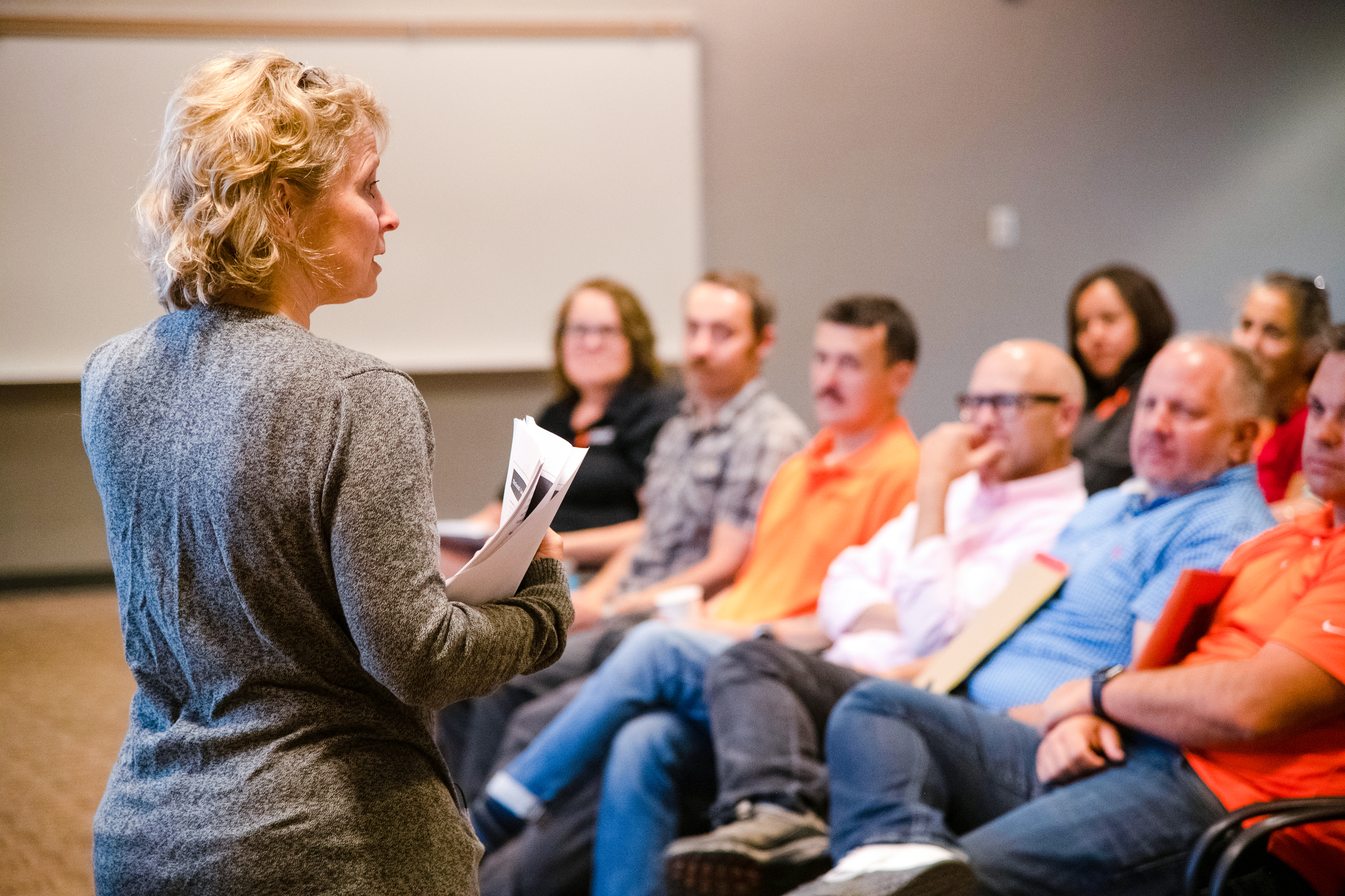 A person giving a presentation to faculty and staff members at ISU