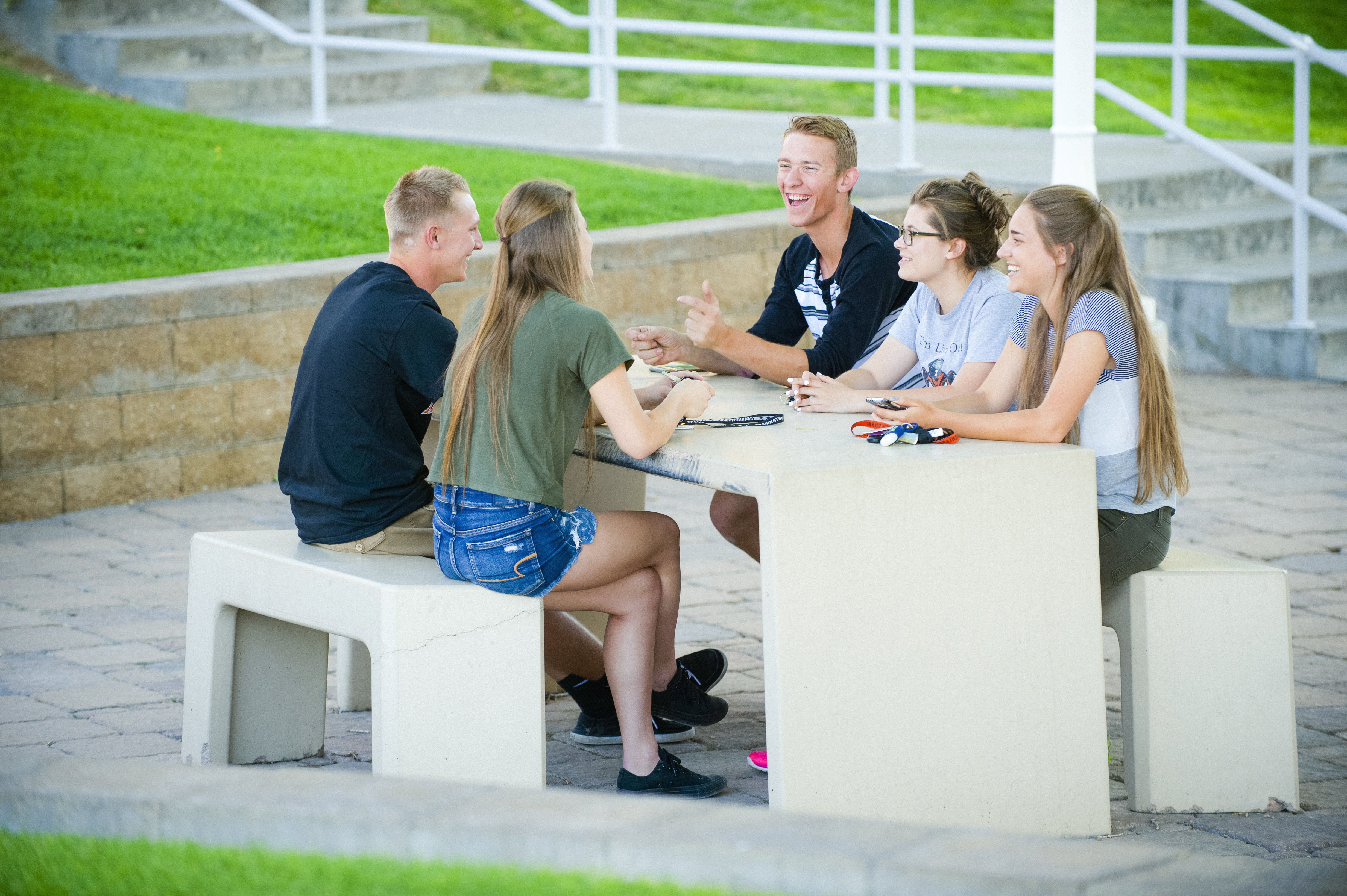 A group of students sitting at a table.