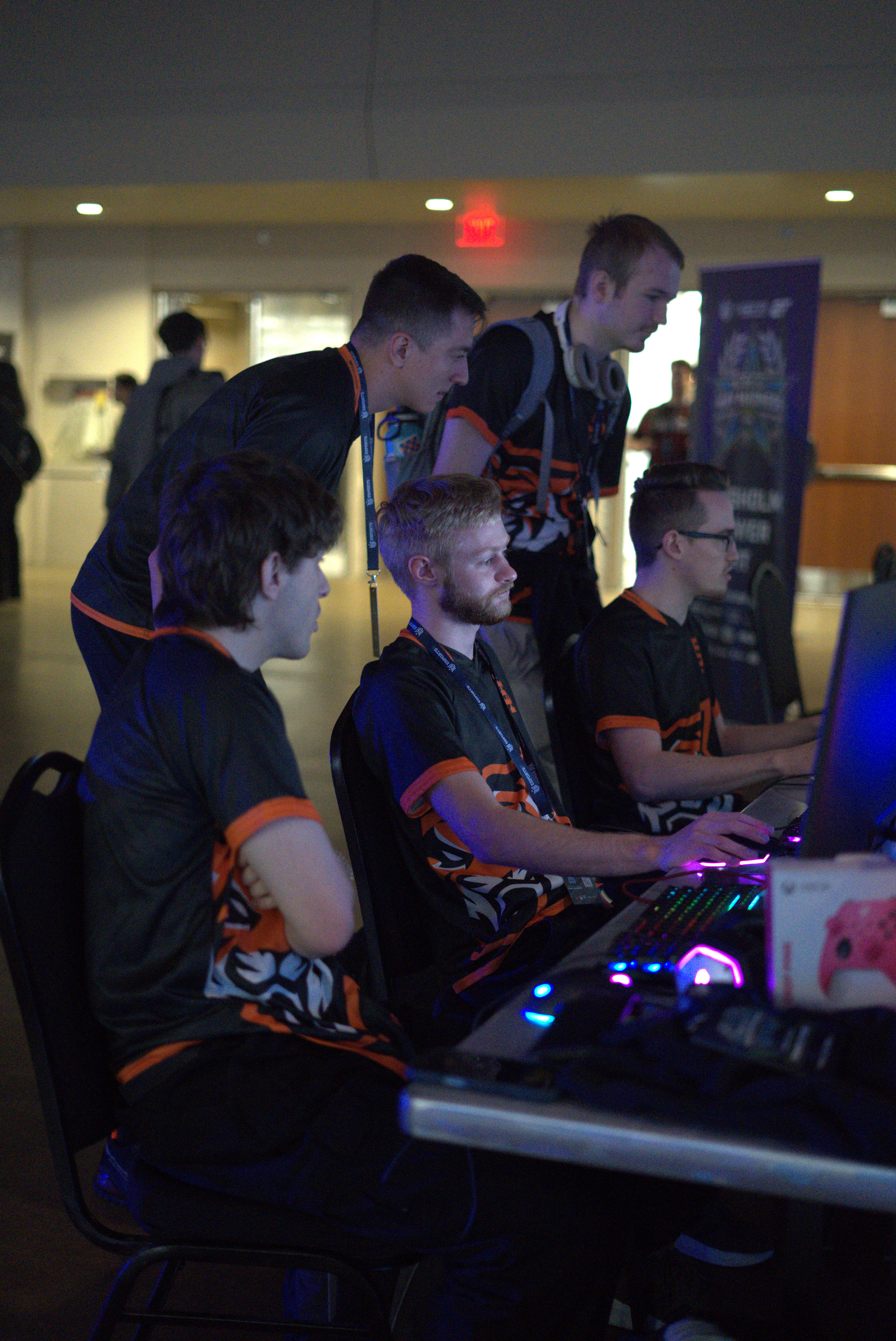Team working together to resolve a computer issue between matches