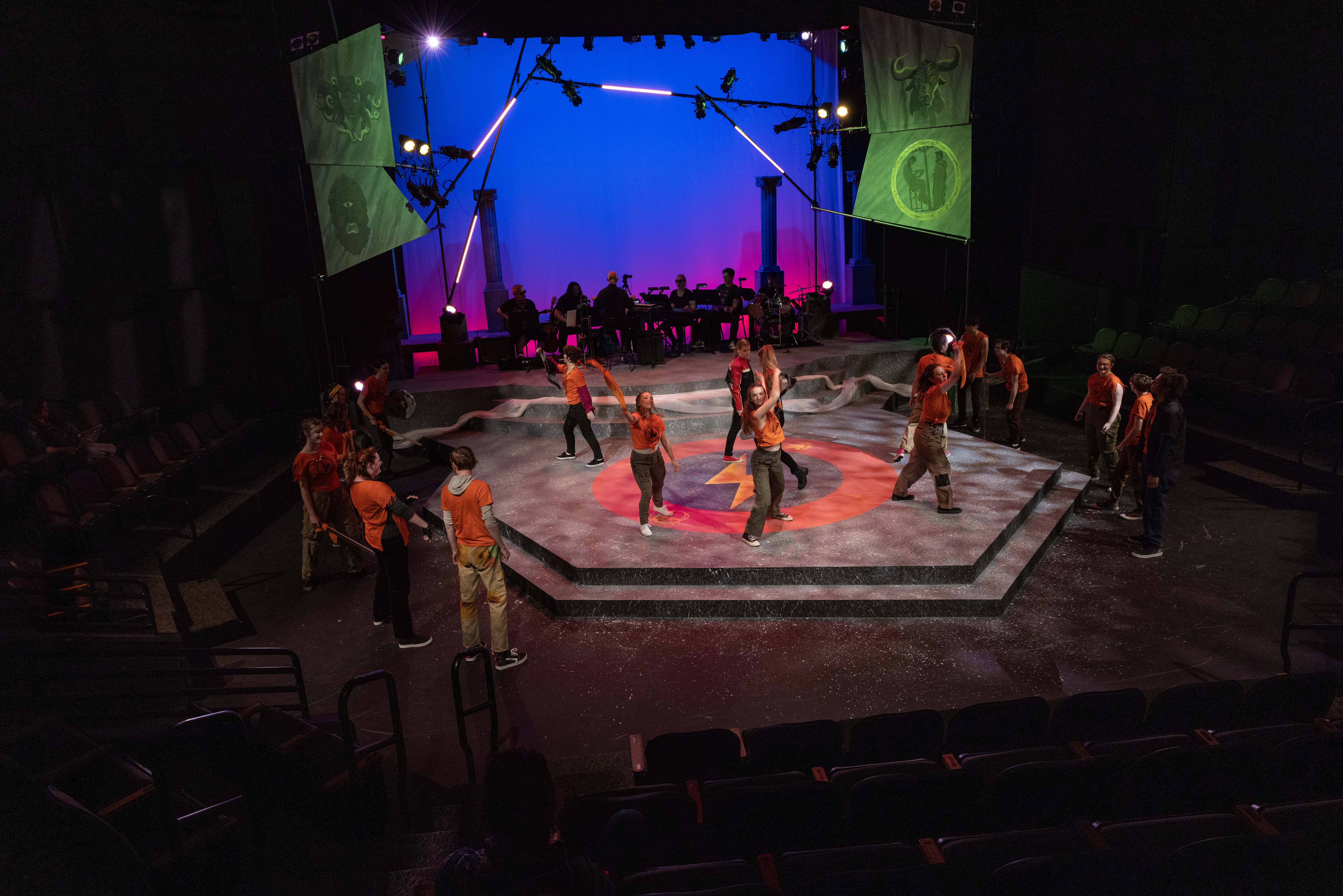 Student actors on stage of the Bistline Theatre