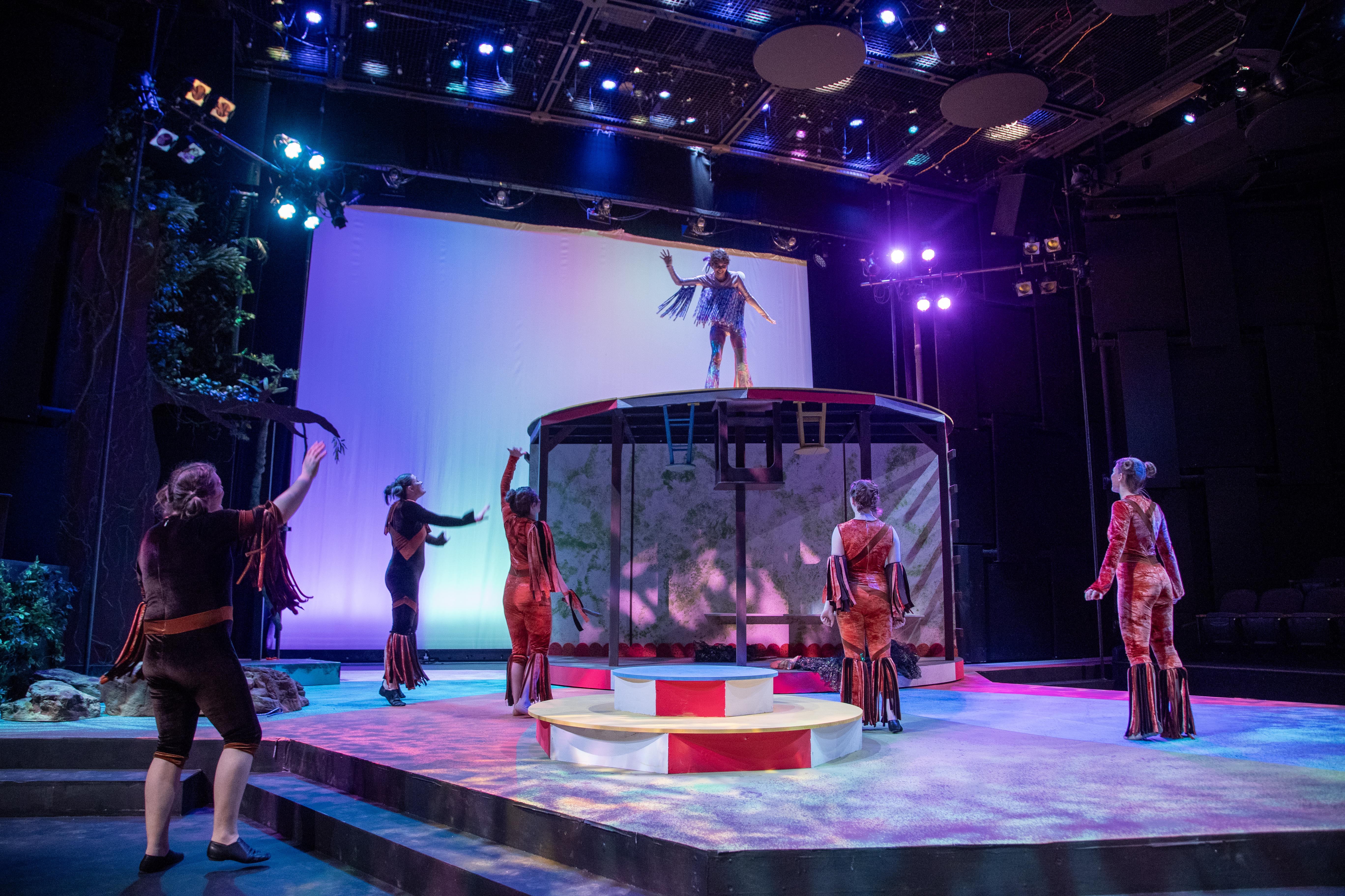 Student actors on stage of the Bistline Theatre