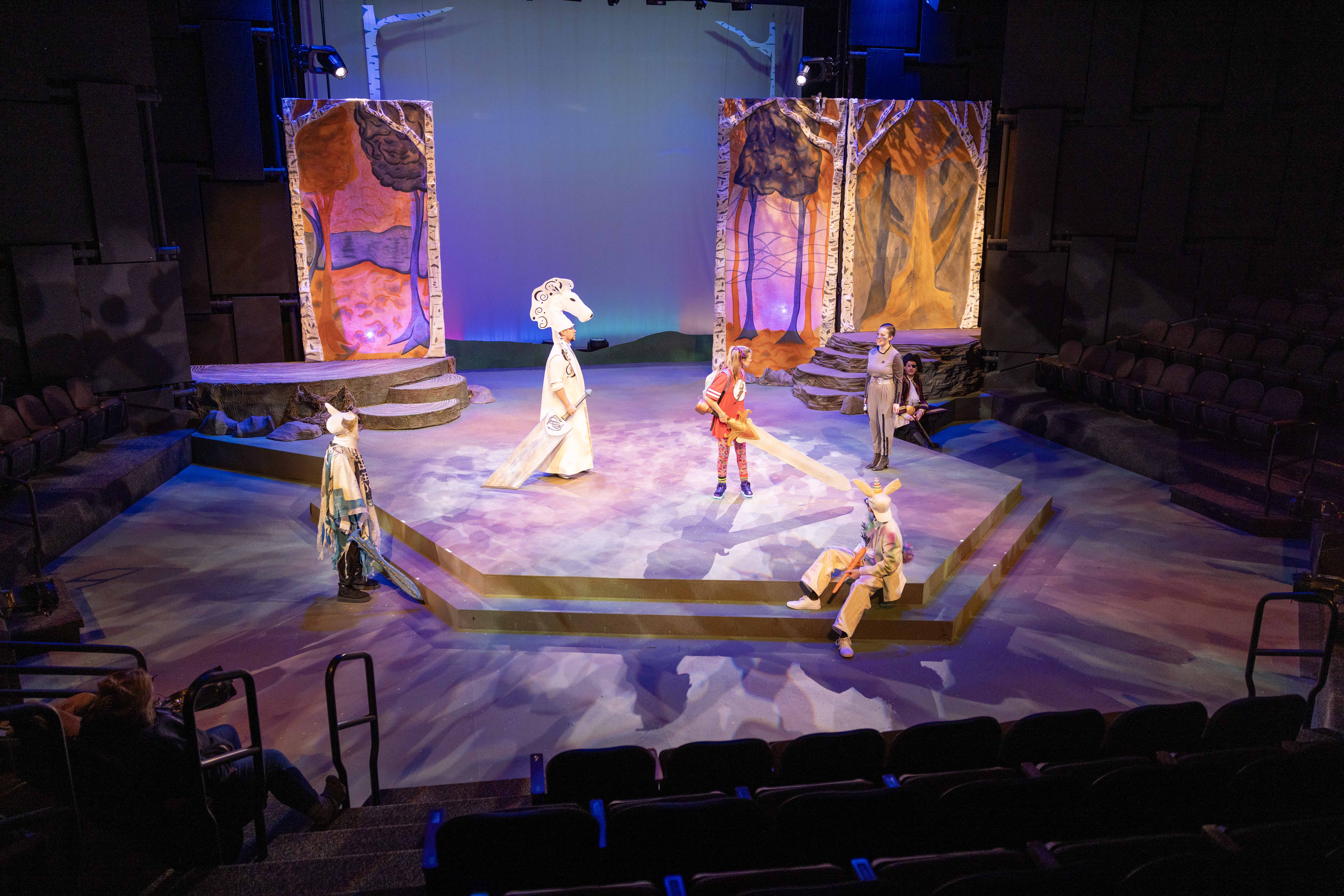 Student actors on stage of the Bistline Theatre