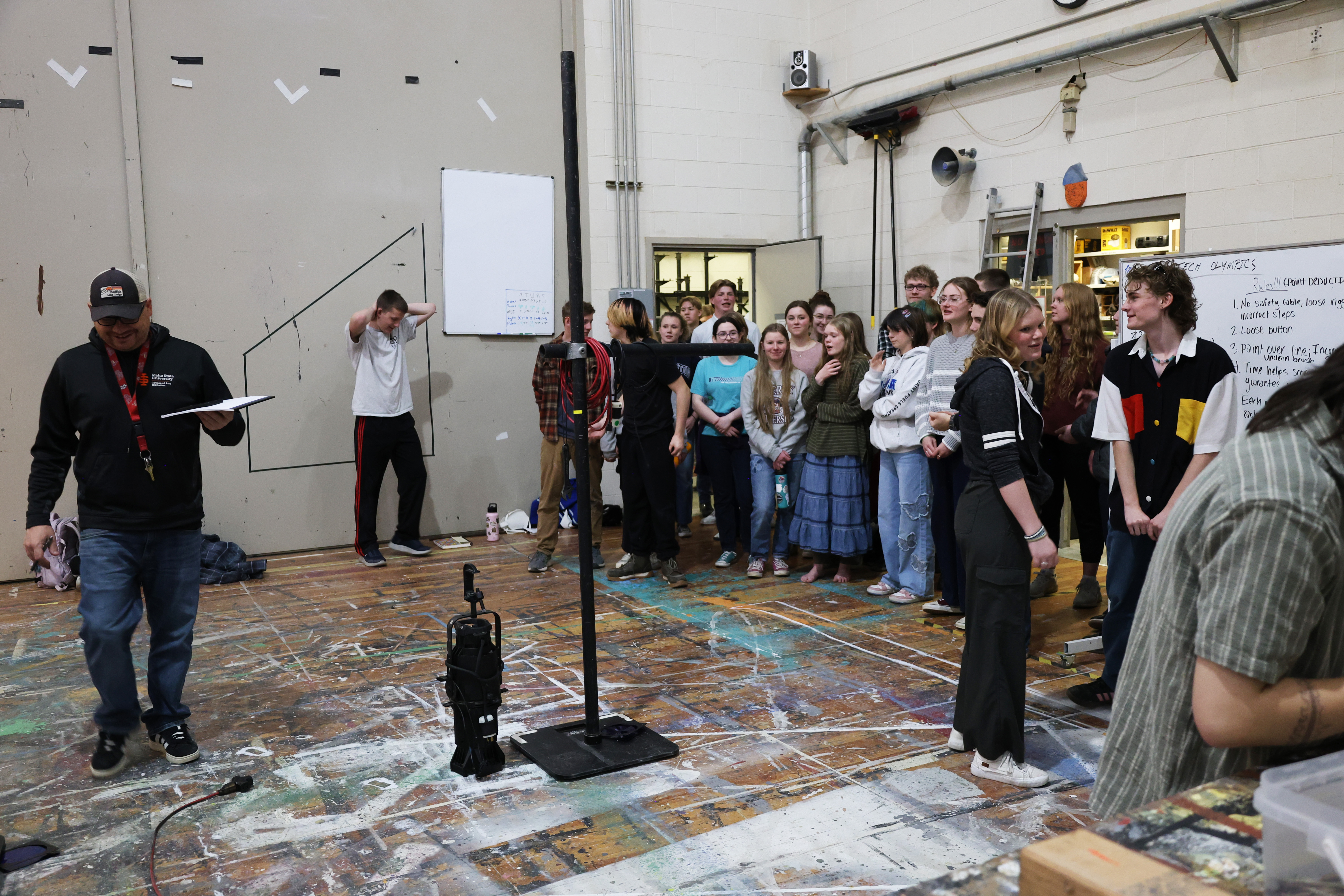 Faculty teaching students in the theatre scene shop