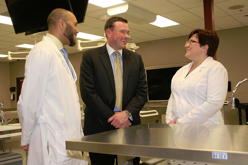 From left, ISU-Meridian’s Noah Harper and Lorinda Smith with ICOM Dr. Robert Hasty, ICOM’s founding dean (center)