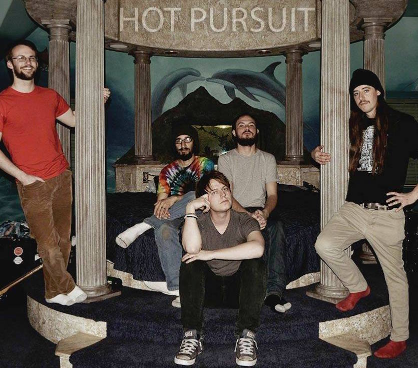 Promo photo of the five-member band hot pursuit.